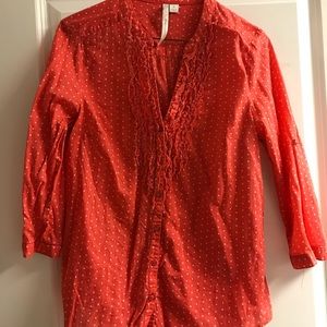 Orange ruffled blouse